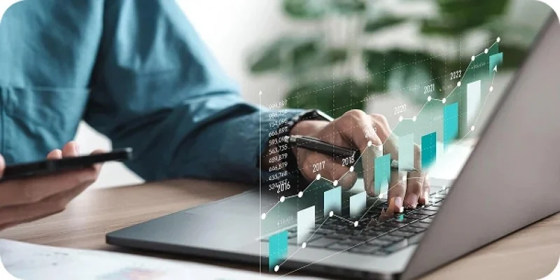 Businessman analyzing digital growth chart on laptop